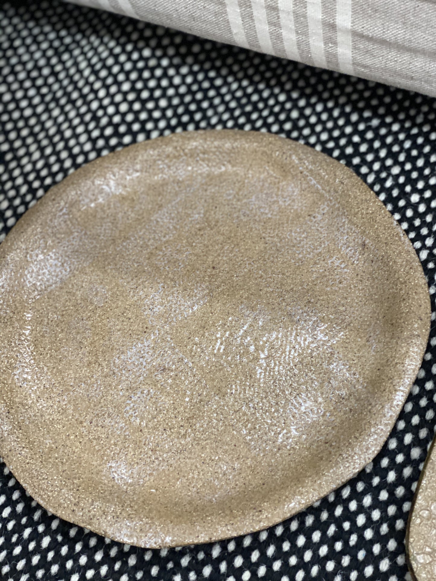 Hand made pottery round plate beige with pattern